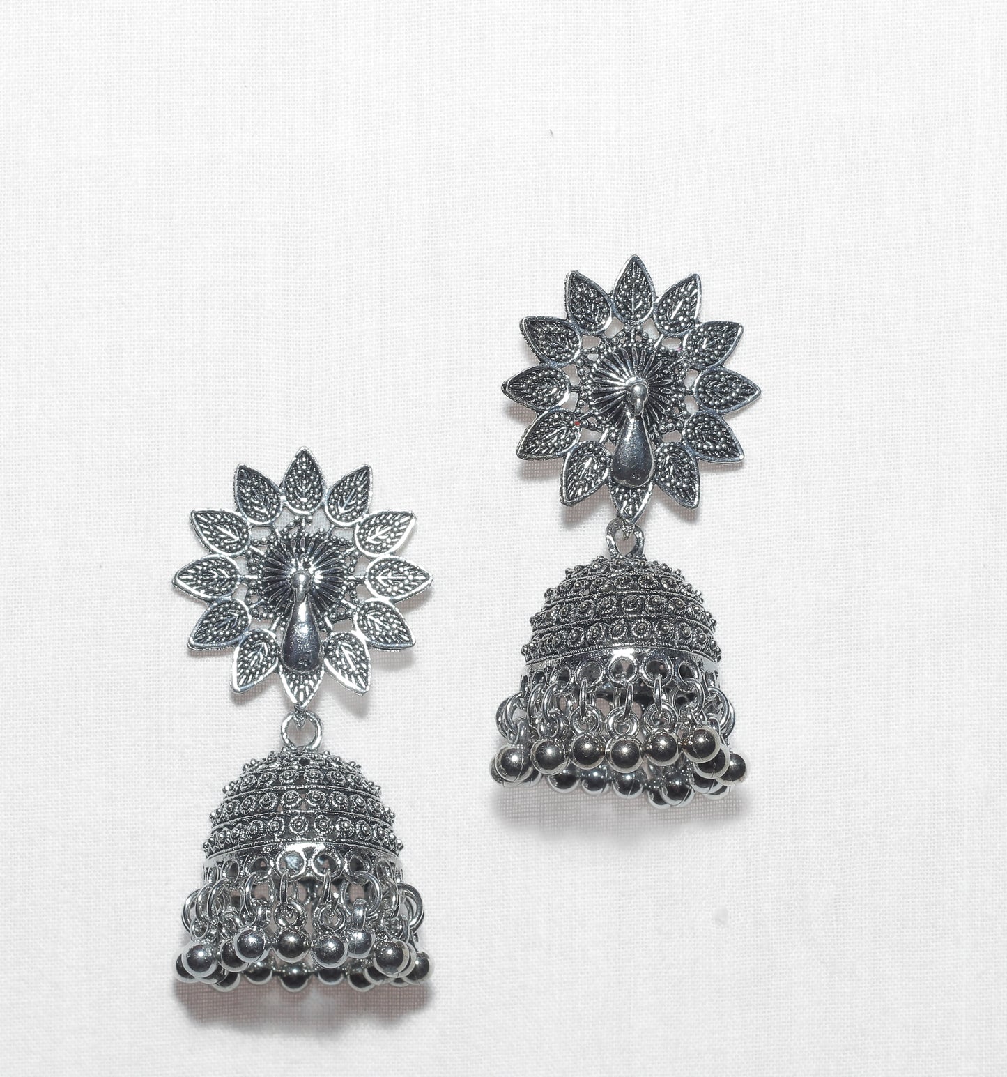 Jhumka with a peacock motif in the center